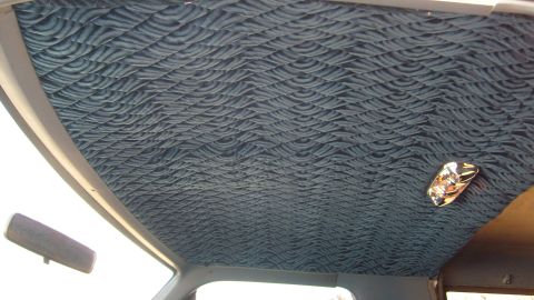 1995 Ford C-150 (Centurion Conversions) - Interior view of a vehicle's headliner and dome light.