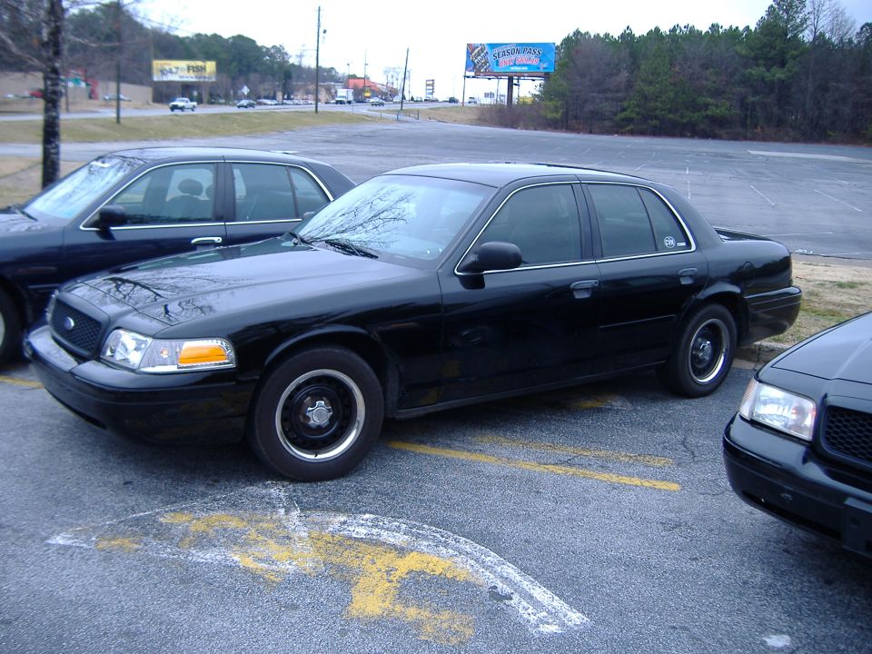 Black 1996 Ford Crown Victoria sedan, 3q front view