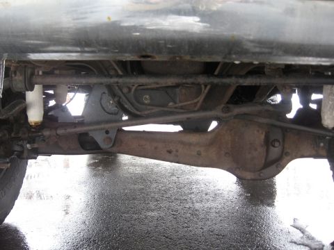 1996 Ford Bronco - Close-up view of the undercarriage, showing suspension and differential components.