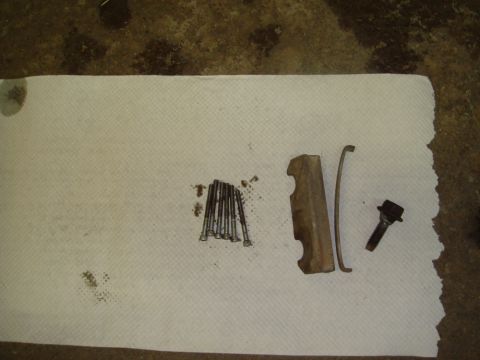 1996 Ford Bronco - Various brake caliper components are arranged on paper towels, possibly before or after maintenance.