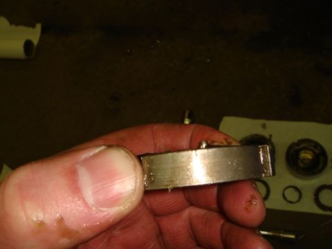 1996 Ford Bronco - A close-up view of a metal bearing part, likely showing signs of wear from use.