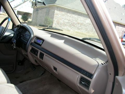 1995 Ford Bronco - Interior view of a 1995 Ford Bronco dashboard, displaying the radio, vents, and steering wheel.