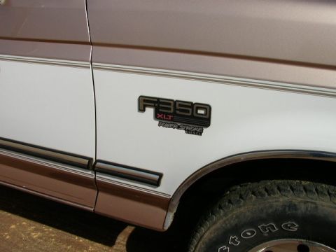 1995 Ford Bronco - Close-up of the F-350 XLT Power Stroke Diesel badge on the side of a truck.