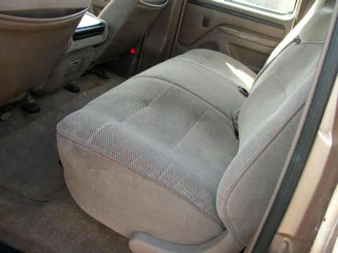 1995 Ford Bronco - Interior view of a vehicle's rear seating area and center console.