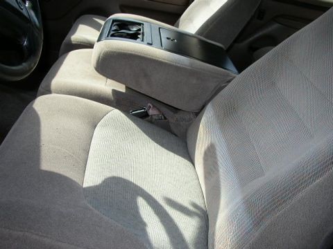 1995 Ford Bronco - Interior view of car seats and center console. Year is not verifiable from the image.