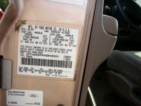 1995 Ford Bronco - Vehicle door sticker details including VIN, tire size, and manufacturing date.