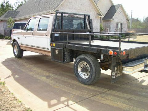 1995 Ford Bronco - This two-tone pickup truck features a flatbed and appears to be from the mid-1990s, though it does not match the registry's claim of a 1995…
