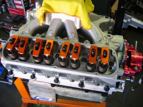 1992 Ford Mustang - Engine components, including orange roller rockers and a yellow cloth covering part of the intake manifold, are visible in this close-up sh…