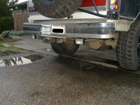 1989 Ford Bronco - The rear of a vehicle, showing the bumper, spare tire, and license plate area.