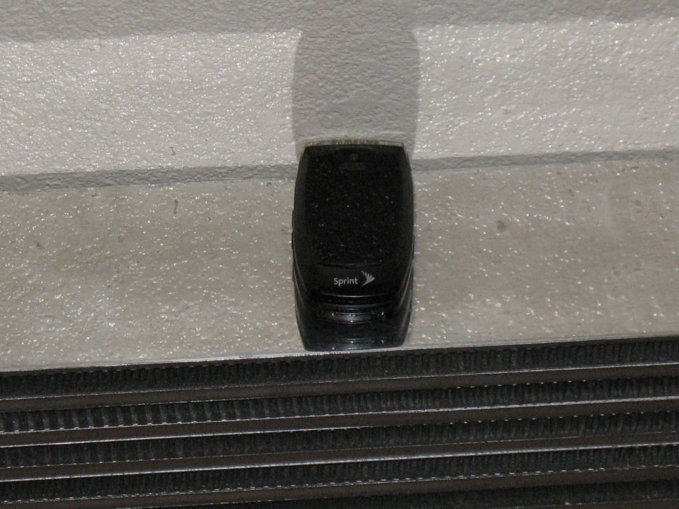 Sprint flip phone placed on a new aluminum radiator or intercooler core for size reference