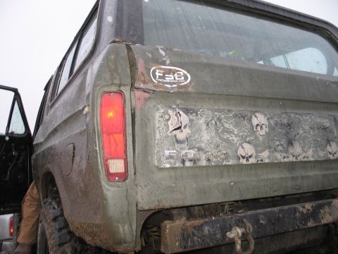 1995 Ford Bronco - This vintage Ford Bronco features a custom skull graphic decal on its rear panel and a prominent F-8 sticker.