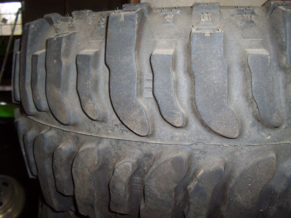 Close-up of a large, aggressive tire tread pattern