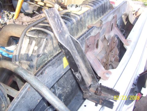1978 Ford Bronco - The engine bay of a vehicle shows the radiator and various hoses, with a date stamp visible.