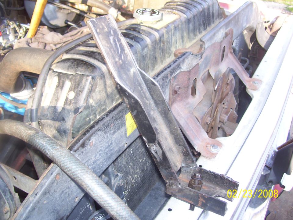 Engine bay with radiator, hoses, and some metal brackets. Date stamp reads 02/28/2008