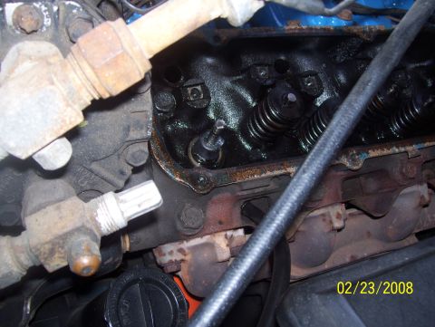 1978 Ford Bronco - Close-up view of engine components, including valve springs and exhaust manifold, with a date stamp visible.