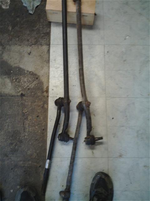 1994 Ford Bronco - Two vehicle steering linkage rods are shown, one appears newer than the other.