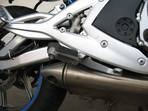 2007 Kawasaki Ninja - Detail shot of a motorcycle's exhaust system and passenger footpeg.