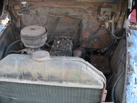 1952 Ford Panel Van - Engine bay view of a 1952 Ford Panel Van, showing the radiator and air cleaner assembly.