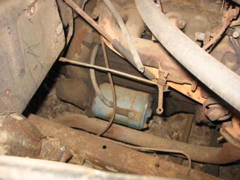 1952 Ford Panel Van - Close-up view of engine bay components, showing various hoses and a blue canister.