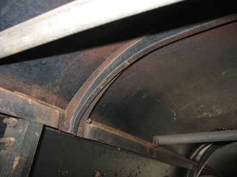 1952 Ford Panel Van - The interior structural supports of a vehicle, showing metal framing and curved ribs.