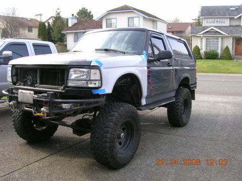 1996 Ford Bronco - This modified Ford Bronco is parked in a driveway with houses in the background. The date stamp reads 02.24.2008.