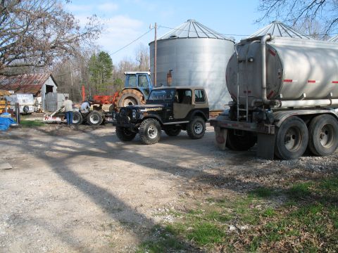 1993 Ford Bronco - Renegade at bin site #2. Tanker on the right, homemade tractor transport trailer in the background. 8830 fullsize tractor with one of the t…