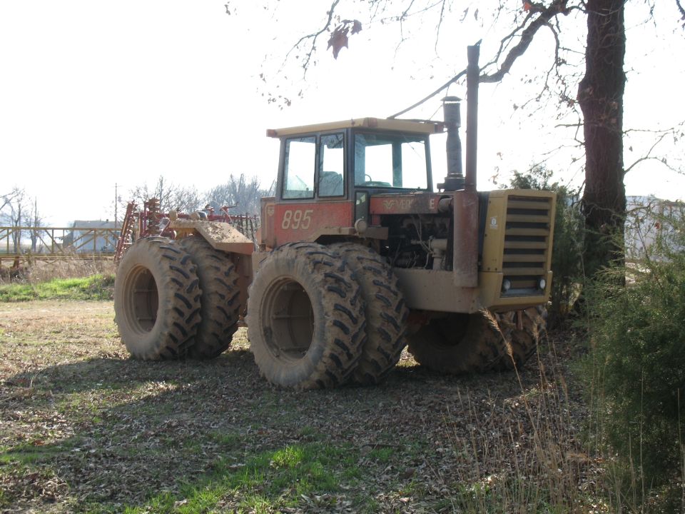 Red Versatile. This one's set up more set up for pulling than getting through hairy terrain. It doesn't have lockers, weighs a shit-ton (all 8 tires have the max amount of ballast), and has wimpy tires. However, the hopped up 855 cid Cummins puts out all kinds of torque.