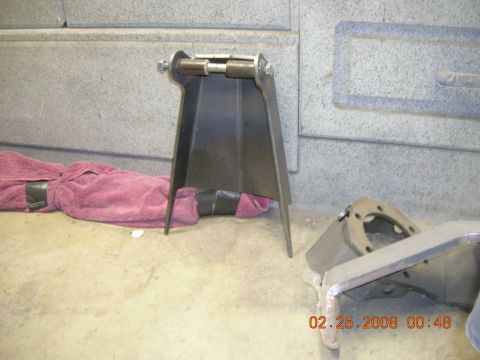 1996 Ford Bronco - Metal brackets are shown on a concrete floor next to a wall. A date stamp is visible in the lower right corner.