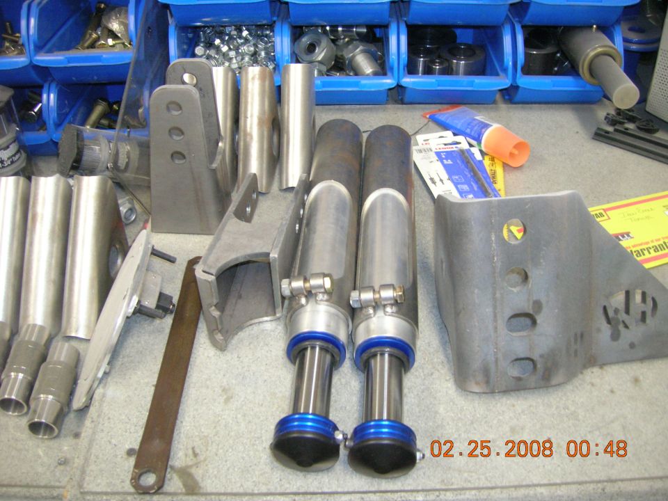 Metal suspension components and hardware in blue bins, with a timestamp of 02.25.2008
