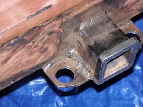 1993 Ford Bronco - Close-up of a trailer hitch receiver, showing its construction and mounting points.