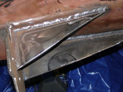 1993 Ford Bronco - Close-up of welded metal brackets, possibly part of a vehicle frame or bumper assembly.