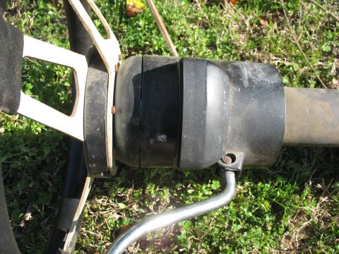 1978 Ford Bronco - Close-up of a vehicle's steering column and a portion of the steering wheel.