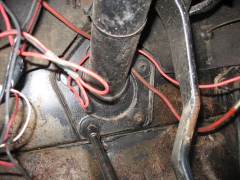1978 Ford Bronco - Detail of the steering column and associated wiring, likely from a vehicle's interior.