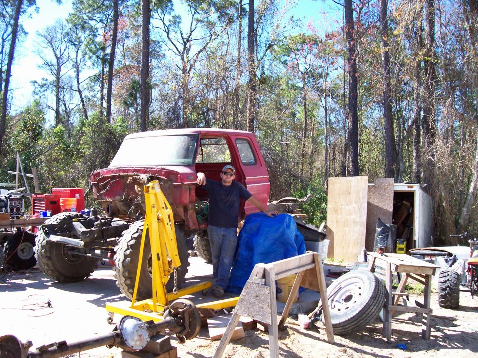 1978 Ford F-250 cab and chassis disassembled, with a man leaning on it