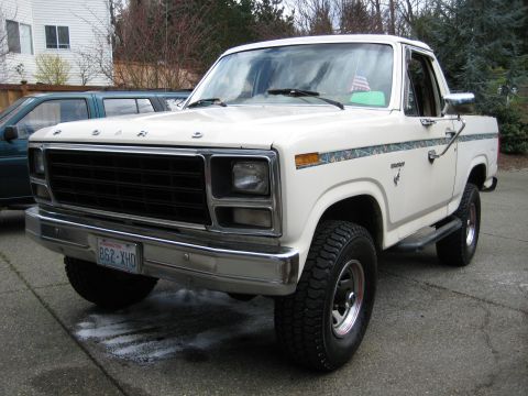 1980 Ford Bronco - This 1980 Ford Bronco features a distinctive camouflage stripe along its side and aftermarket wheels.