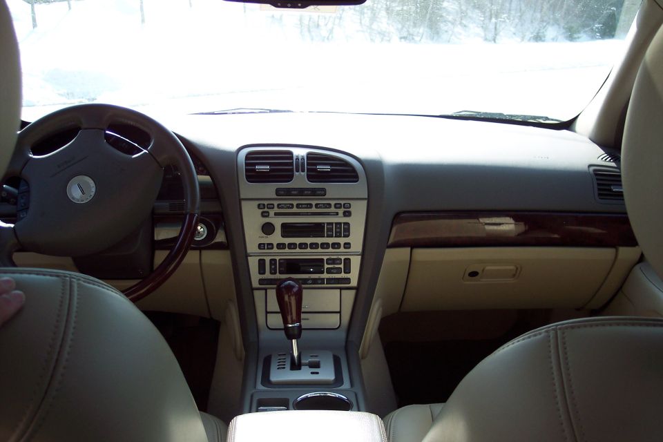 Interior of a 2006 Lincoln LS showing the dashboard, steering wheel, and center console