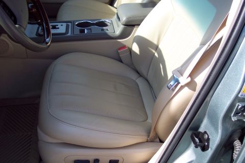 2001 Ford Crown Victoria - The interior of a car is shown, focusing on the passenger seat and the center console area.
