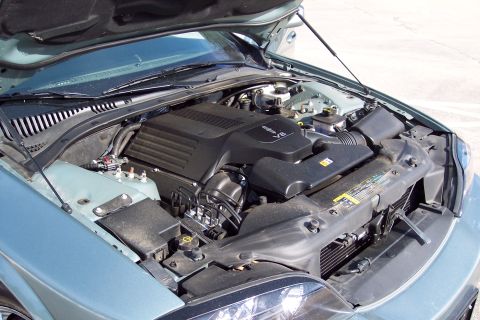 2001 Ford Crown Victoria - Engine bay of a 2006 Lincoln LS, showing the V8 engine and surrounding components.