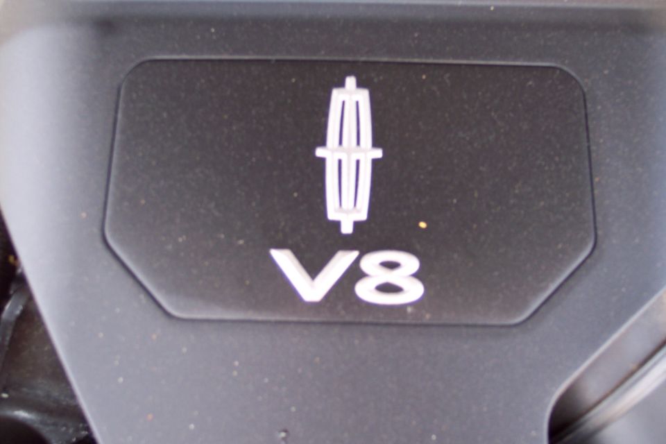 Close-up of a Lincoln V8 engine cover