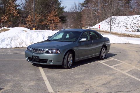 2001 Ford Crown Victoria - A 2006 Lincoln LS sedan is parked outdoors during winter with snow visible.