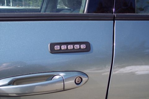 2001 Ford Crown Victoria - Close-up of a car's side door, showing the keypad entry system and door handle.