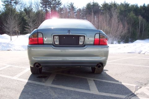 2001 Ford Crown Victoria - Rear view of a Lincoln LS V8 sedan parked in a snowy lot.