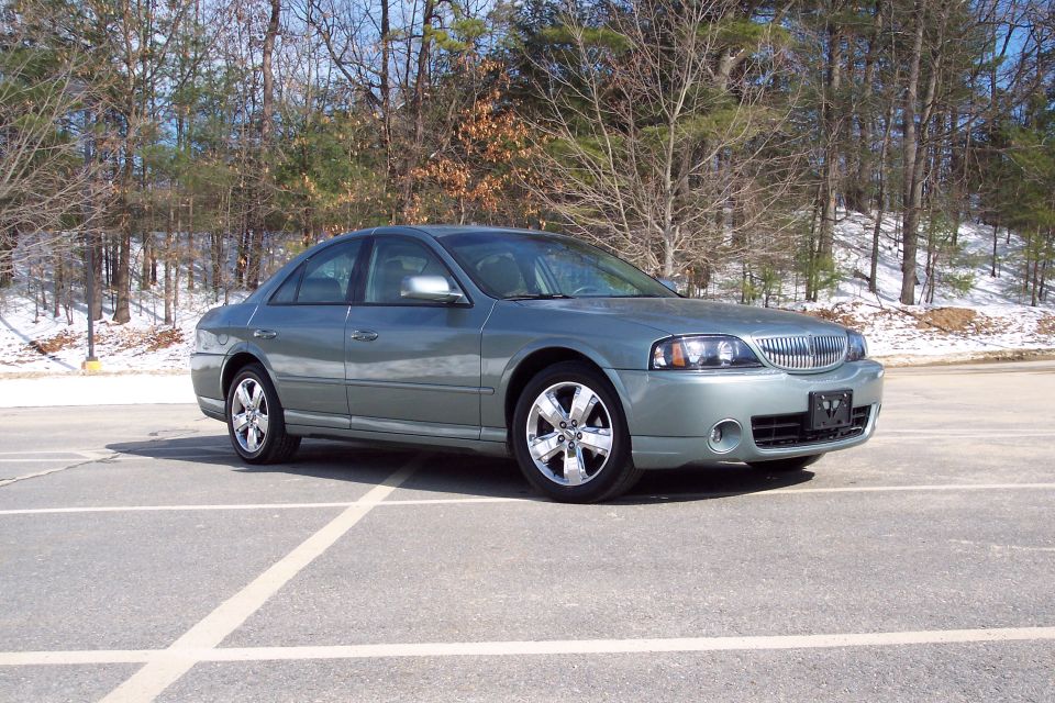 Gray 2006 Lincoln LS sedan parked in a lot, front 3/4 view. Snow on the ground