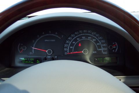 2001 Ford Crown Victoria - Interior view of a vehicle's dashboard, displaying the speedometer and tachometer.