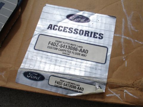 1993 Ford Taurus - Packaging for Ford custom carpeted floor mats, part number F4DZ-5413086-AAD, is shown.