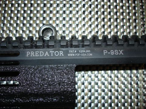 2005 Nissan Titan - Firearm receiver shows "PREDATOR" model name and manufacturer website.