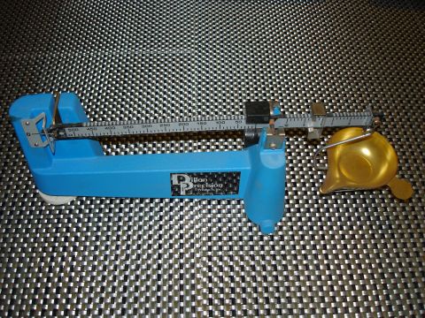 2005 Nissan Titan - A blue Dillon Precision scale with a yellow pan is shown against a textured background.