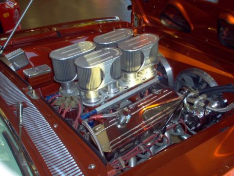 1967 Chevrolet Chevelle - This engine features a high-performance setup with multiple carburetors and polished components.