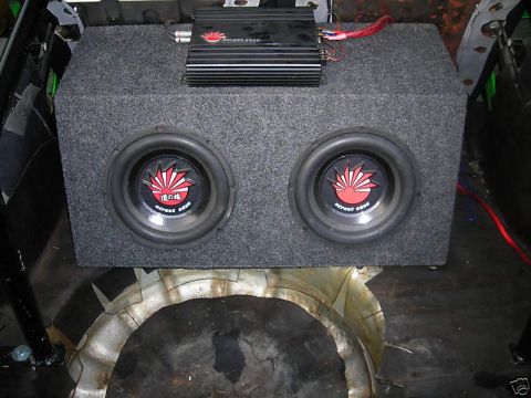 1994 Ford Probe - Car audio amplifier and dual subwoofer box installed in a vehicle's trunk area.