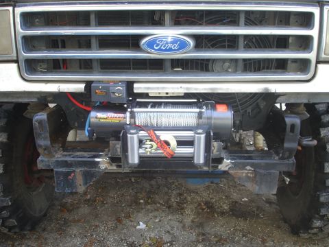 1989 Ford Bronco - Front view of a Ford truck with an aftermarket winch installed.